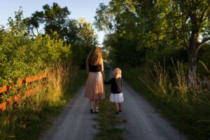 mom and daughter walking